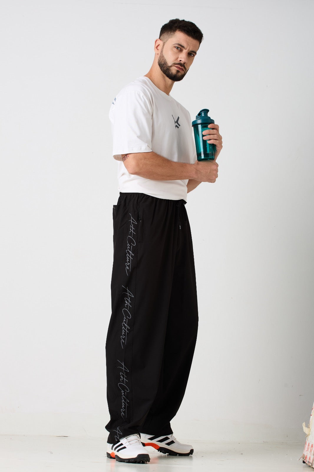 ATHCULTURE Signature Script Track Pant — Black