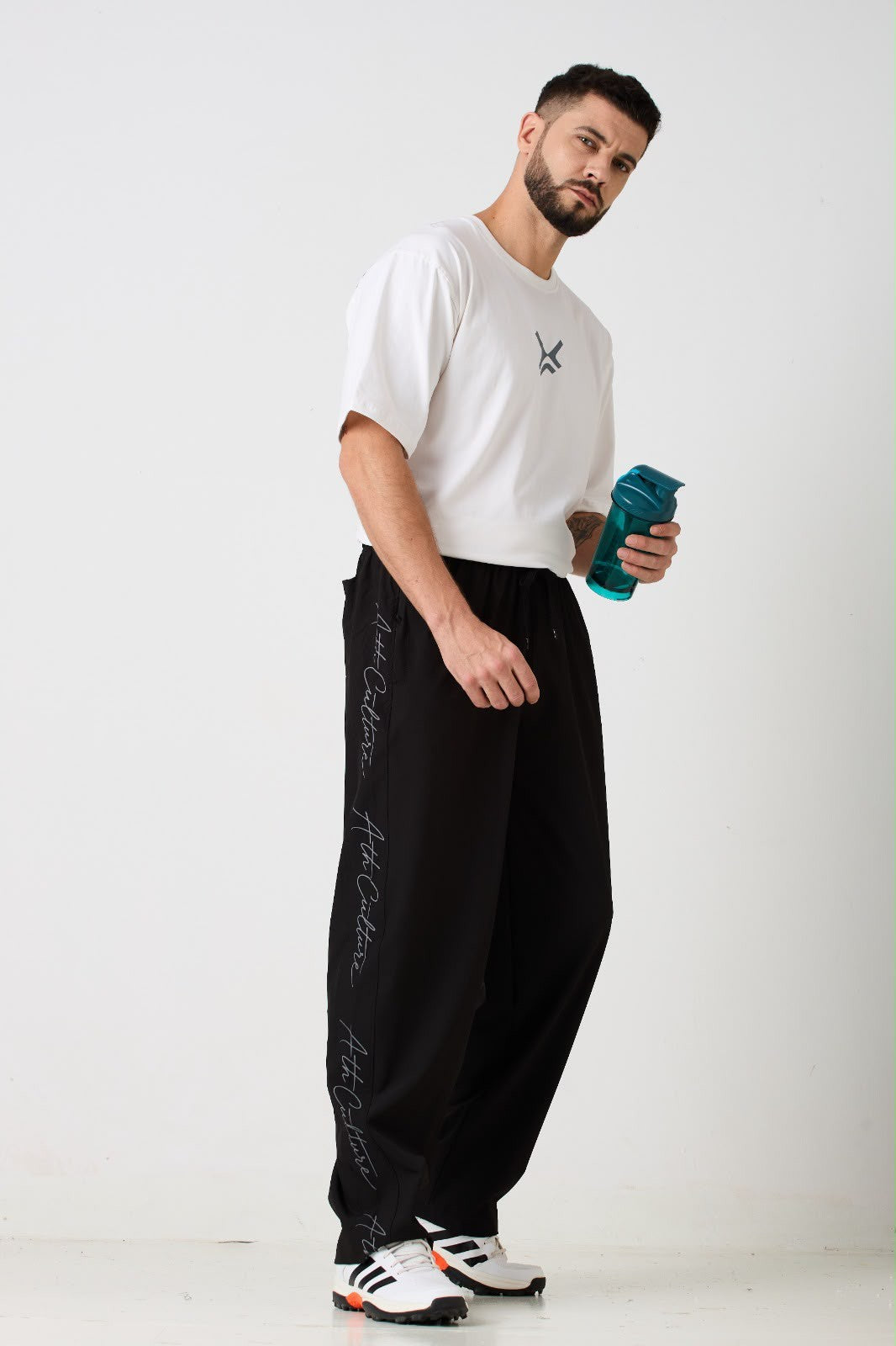 ATHCULTURE white oversized tee and black signature script pants